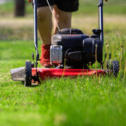 View 20-inch steel cutting deck, side-discharge gasoline-powered push lawn mower, with engine oil, available in red and black, suitable for outdoor yards. image 2